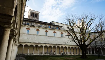 Campanile della chiesa dei SS Faustino e Giovita dal chiostro di San Faustino DEM Economia